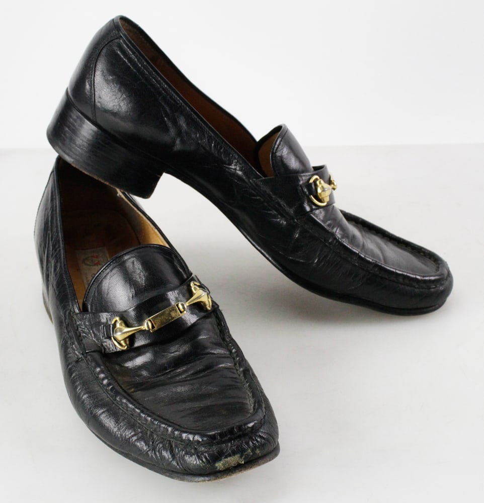 Gucci Black Loafers: Gucci black loafers, circa 1975, made in Italy, M43/10. Provenance: Woburn, Massachusetts collection.