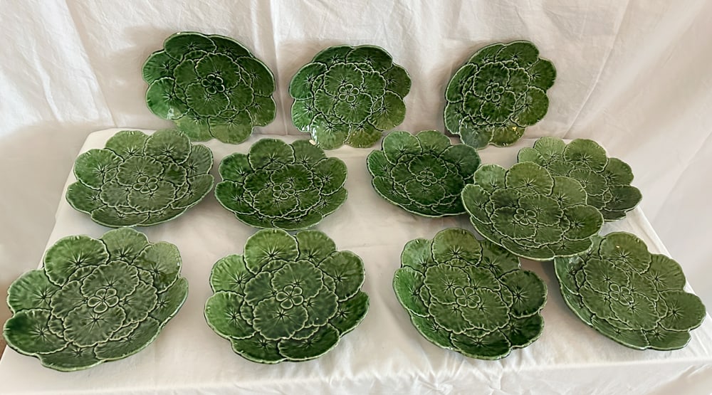 Group of Majolica Green Plates, Portugal: Group of majolica green plates, Portugal, 8 1/4" diameter, (12) total. Provenance: Estate of Howard D. Monroe, Jr., West Palm Beach, Florida.
