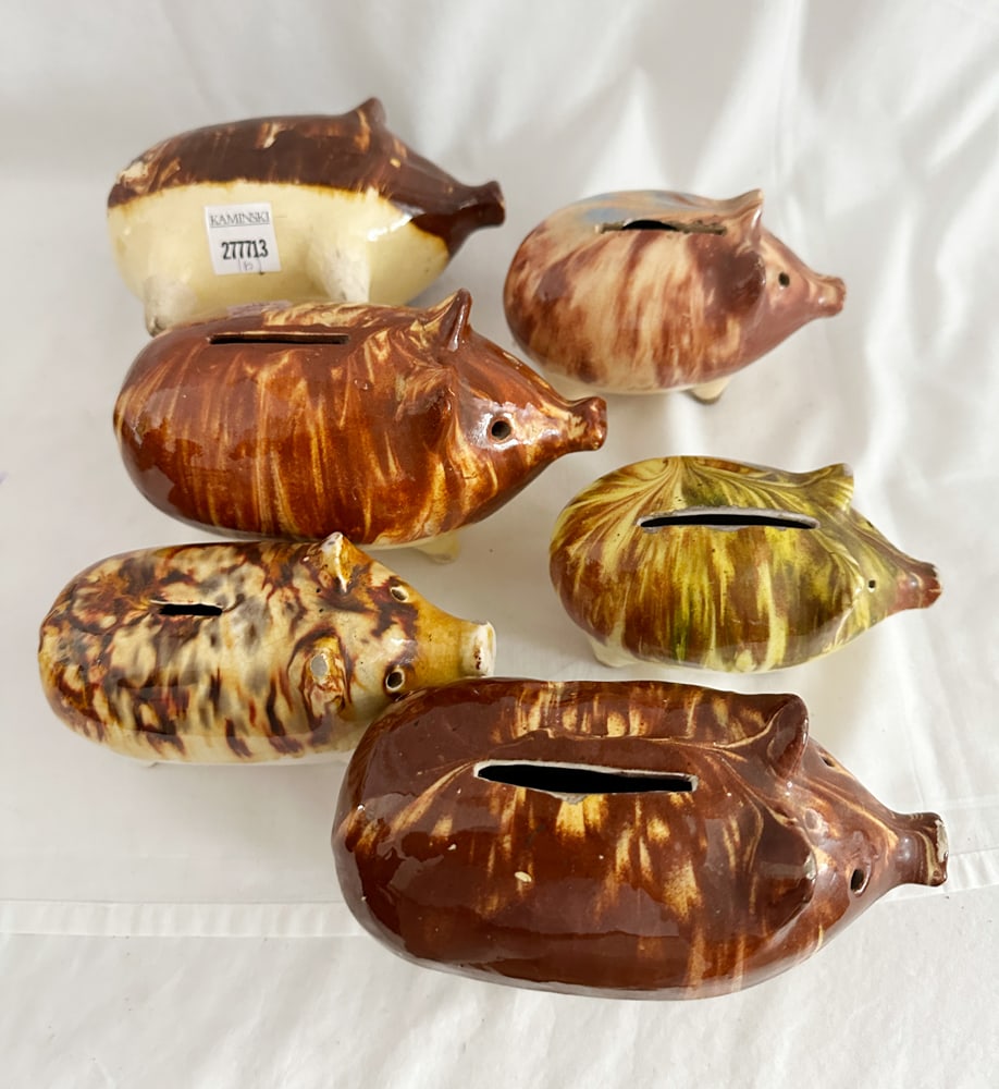 Group of Glazed Stoneware Piggy Banks: Group of (6) glazed stoneware piggy banks, largest 4" x 6 1/4" x 3". Provenance: Estate of Howard D. Monroe, Jr., West Palm Beach, Florida.