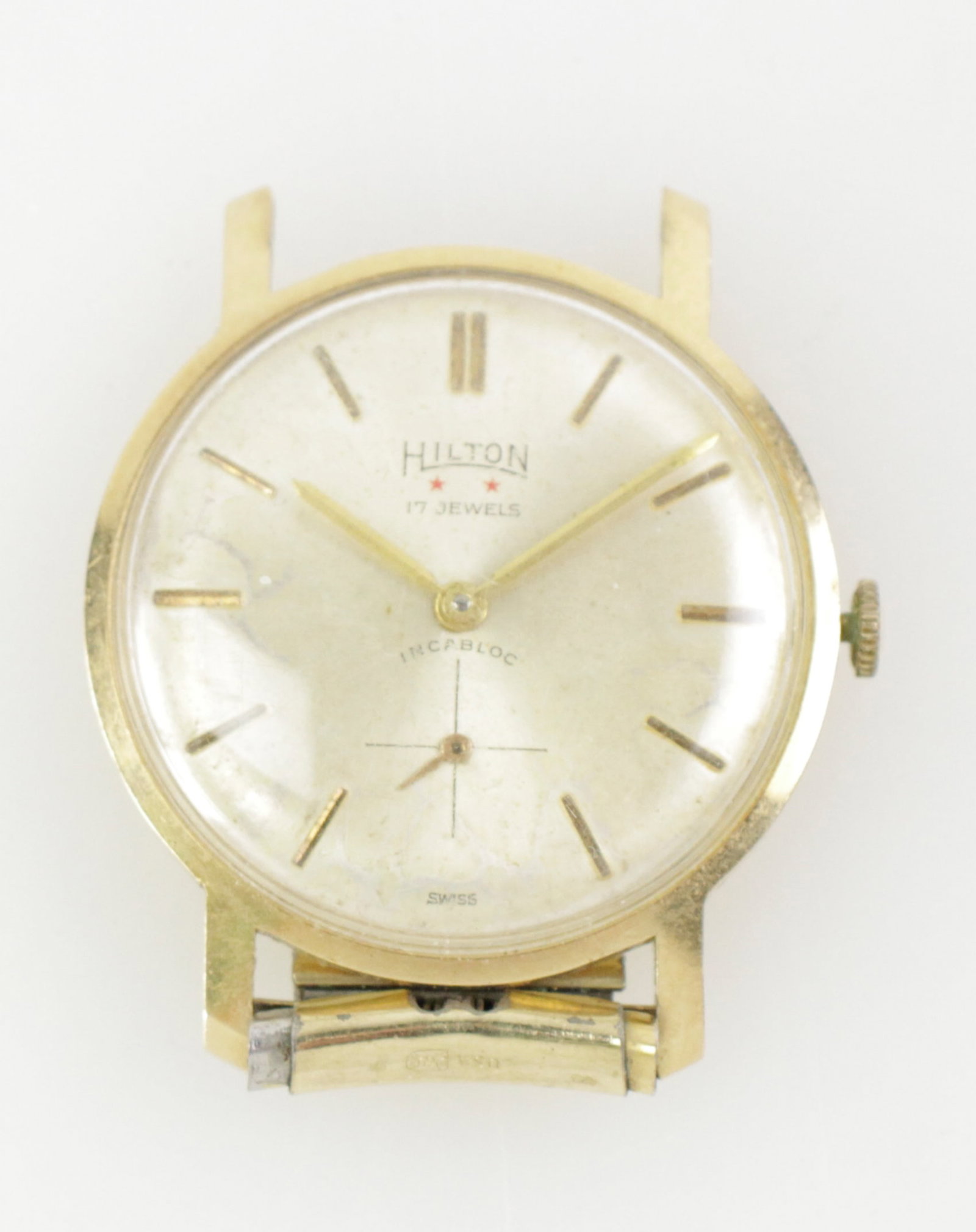 Men's 14k Yellow Gold Hilton 17-Jwl Watch: Men's 14k yellow gold Hilton17-jewel incabloc wrist watch, 1 5/8" diameter face, lacking band. Approximately 22.7 grams (including movement). Operational condition unknown. Provenance: Estate of Howar
