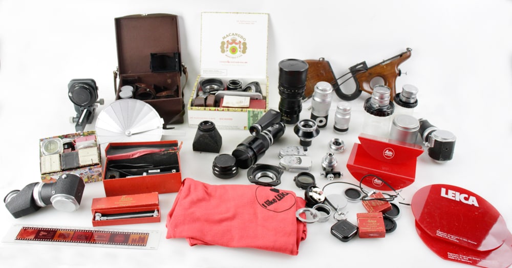 Group of Leica Accessories, Supplies, Lenses: Group of Leica accessories, supplies and lenses, to include: Tekyt Model 1:48/280, # 1850942; Super Angulon Model 1:4/21, #1673411; Hector Model F=12.5cm; Hektor Model 2.8/1:63, # 1121072; Hektor Mode