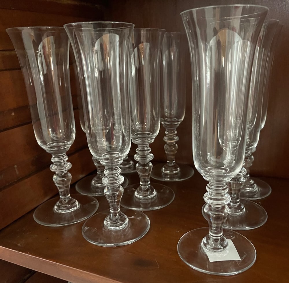 Baccarat Signed Champagne Flutes: Group of signed Baccarat champagne flutes, (9) total. Provenance: Estate of Howard D. Monroe, Jr., West Palm Beach, Florida.