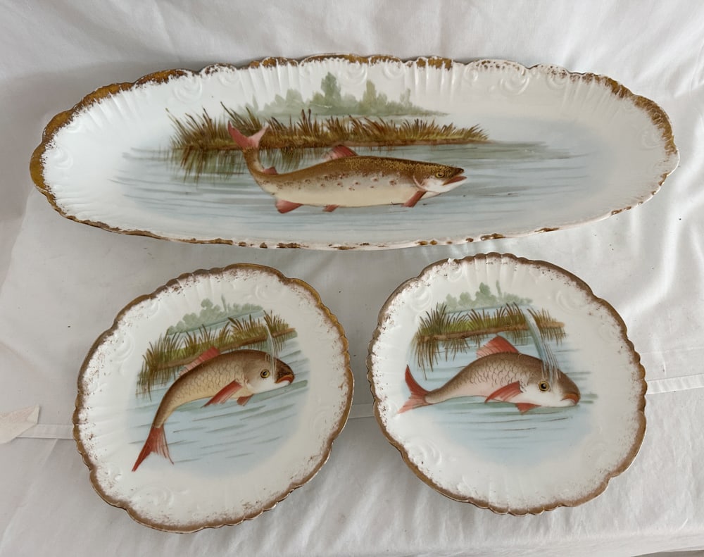 BT Co. Limoges France Fish Service Platter and Plates: Burley and Tyrrell Co. Limoges France fish service, platter 2 1/2" x 23 1/4" x 9 1/4", plates 8 1/4". Chip to plate. Provenance: Estate of Howard D. Monroe, Jr., West Palm Beach, Florida.