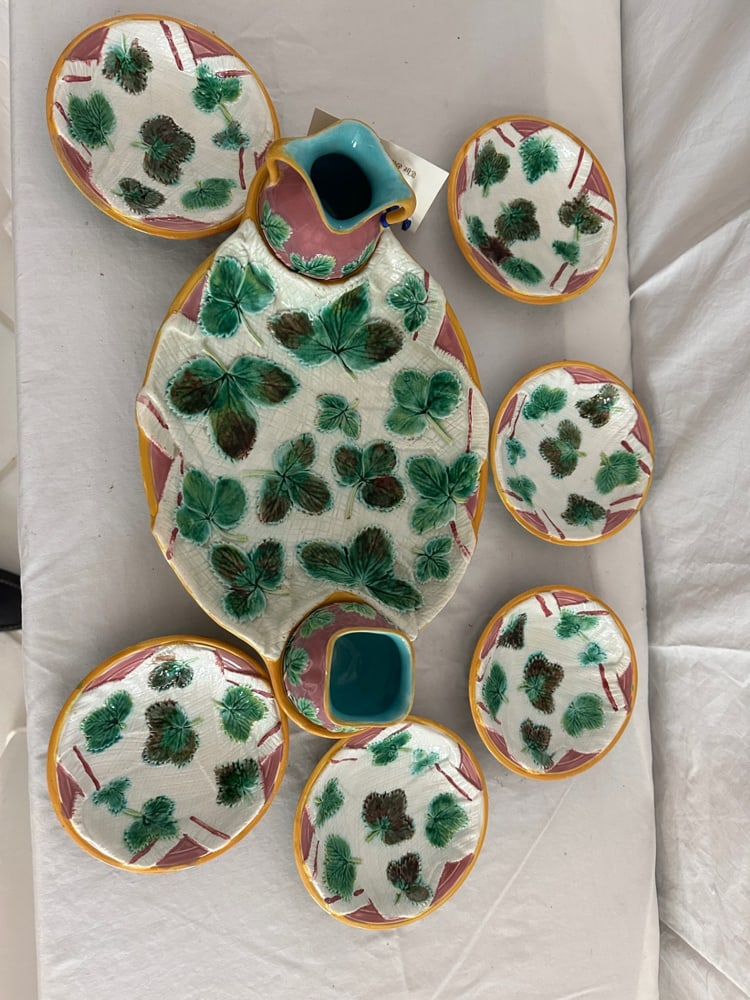 George Jones Majolica Strawberry Pieces: Group of George Jones majolica strawberry leaf, strawberry service pieces, circa 1870, (9) total. Provenance: Estate of Howard D. Monroe, Jr., West Palm Beach, Florida.