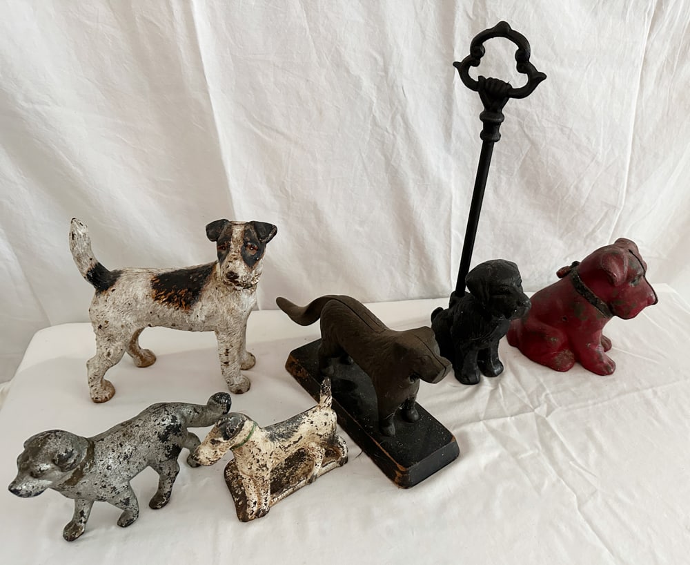 Assorted Iron Dog Doorstops: Assorted iron dog doorstops, (6) total, tallest 8" x 8" x 3". Provenance: Estate of Howard D. Monroe, Jr., West Palm Beach, Florida.