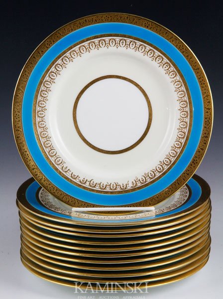 12 Mintons Plates: Set of twelve Mintons England For Davis Collamore NY turquoise and gold plates, 8 7/8" dia. Two with gilt wear, one with most of the turquoise chipped off.
