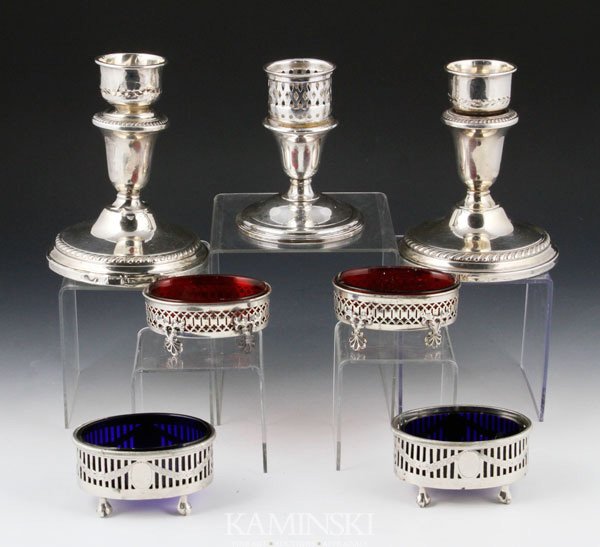 Sterling Silver Hollowware: Lot of sterling silver hollowware to include a pair of weighted candlesticks, 5 1/2" h; a single weighted candlestick; two pairs of salt dishes, one with cobalt glass and the other with ruby glass ins