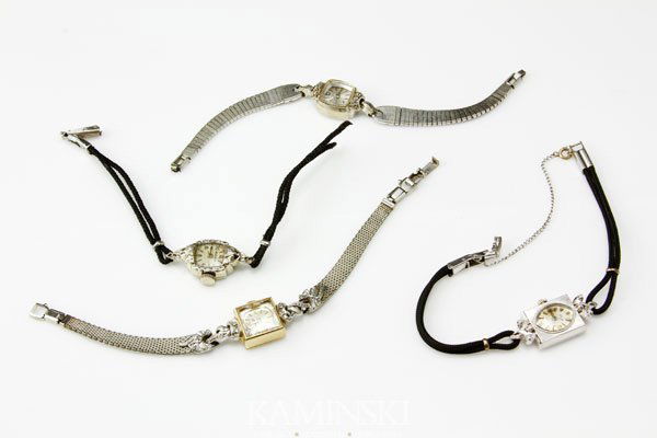 4 Antique Ladies Watches: Lot of four antique ladies 14K gold and diamond wrist watches with straps, two Bulova, 2 Benrus, 3 are 6", 1 is 7".