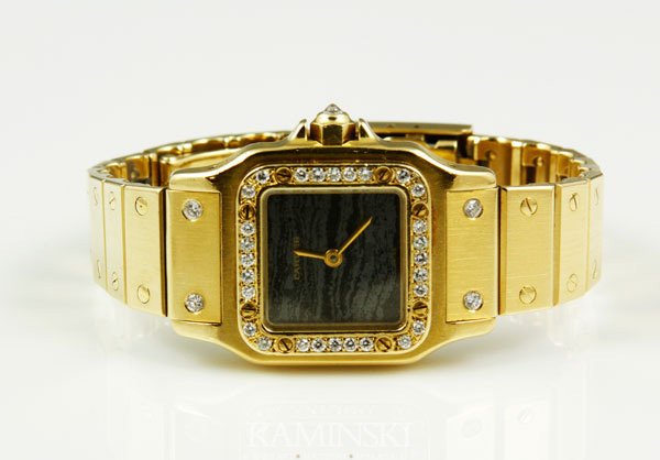 18K Gold and Diamond Cartier Watch: 18K Yellow gold and diamond Cartier watch, 32 diamonds, 7/8" square face, serial number 090103177, "Automatique", approximately 3.2 oz/58 DWT TW (including movement) operational condition unknown.