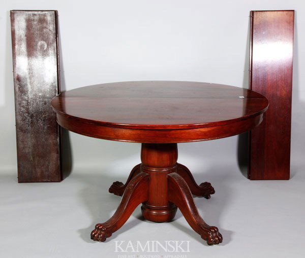 Mahogany Dining Room Table: Mahogany dining room table and chairs, four leaf table with ball and claw feet, on split pedestal, four Chippendale style mahogany dining room chairs, table 48" dia.