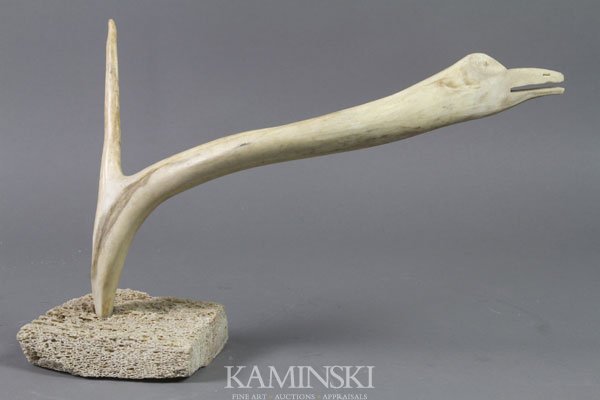 Inuit Carved Antler Bird: Isaac (listed artist), bird, marrow bone and antler on stand, 6 1/2" x 13". Purchased in Spencer Bay.