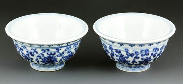 Chinese Pair of Blue and White Cups: Pair of blue and white cups, China, 3 5/8" x 1 1/8".
