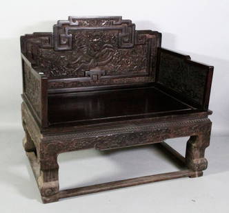 Chinese Zitan Throne: Antique Zitan wood throne, China, the back rest panel carved with a dragon in the center, surrounded by an intricately carved fire and cloud pattern, two bats in the bottom corners, the armrests decor