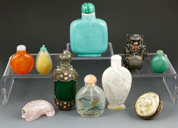 Chinese Lot of Snuff Bottles: Lot of ten snuff bottles, China, to include one green porcelain, two carved shell, two metal with inlaid stones, two agate, one inside painted, one green stone, and one rose crystal carving, largest 3