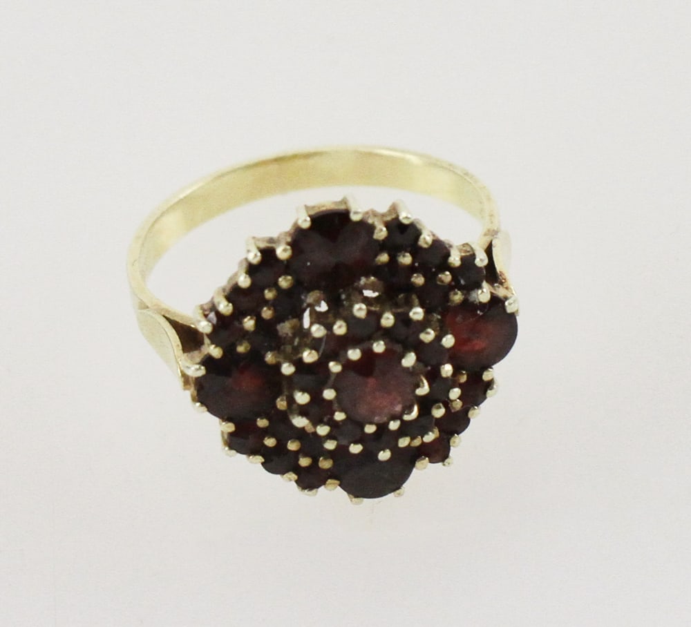 14k Gold and Garnet Ring: 14k gold and garnet ring, size 6. Approximately 4.81 grams TW. Provenance: Stoneham, Massachusetts collection. PLEASE NOTE: payment for silver, gold, jewelry, and coins must be made via wire transfer,