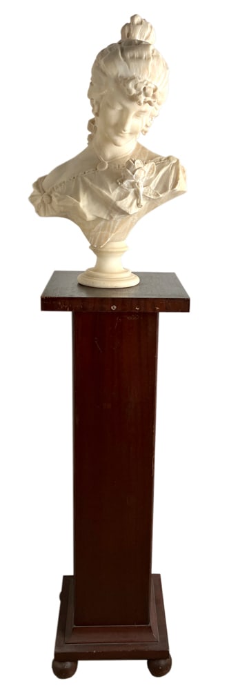 Marble Bust of Woman on Wood Pedestal: Marble bust of a woman, 24" H x 16" W x 12" D, in excellent condition, on wood pedestal base, approximately 4' H.