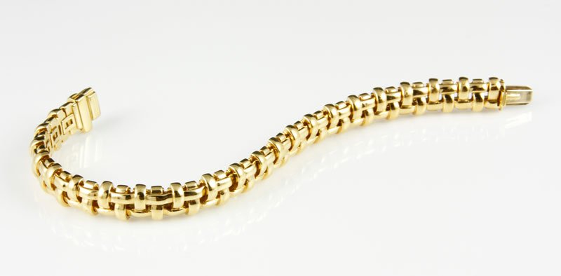 18K Gold Tiffany & Co. Bracelet: 18K yellow gold bracelet with basket weave design by Tiffany and Company with Tiffany and Company box, 7 1/4" long x 1/4"w, approximately 1.7 oz/30 DWT TW.