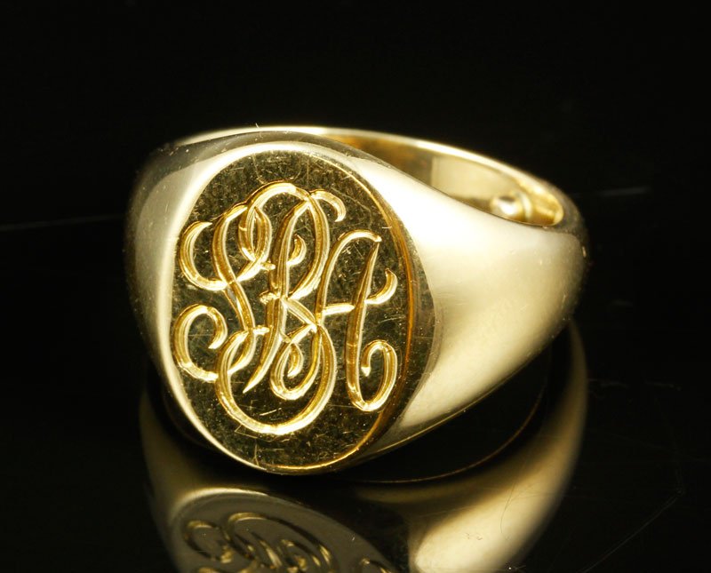 18K Gold Tiffany & Co. Signet Ring: 18K yellow gold signet ring by Tiffany and Company with engraved initials "SAB", size 7, with sizing balls inside shank, approximately .5 oz/9 DWT TW.