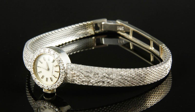 Ladies' 14K Gold and Diamond Movado Watch: Ladies' Movado 17K white gold and diamond watch, 6 1/2" .6 oz/ 11DWT TW (excluding movement), operational. From the collection of Nayereh Seifi Samii, the first female member of the Iranian Parliament