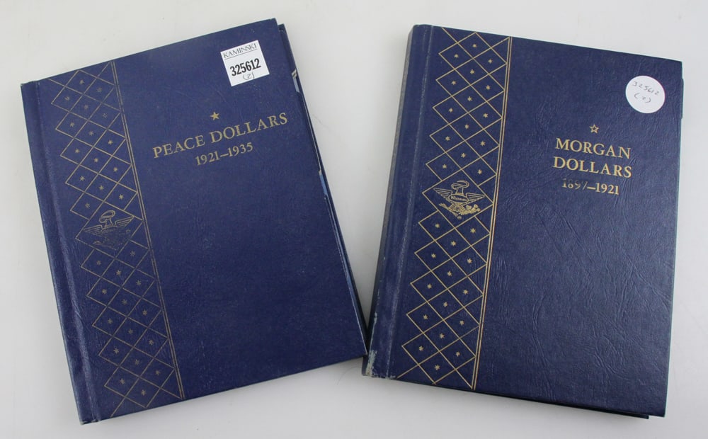 Morgan and Peace Dollars in Blue Books: Morgan and Peace dollars in Blue Books, random dates, (51) coins. PLEASE NOTE: payment for silver, gold, jewelry, and coins must be made via wire transfer, cash, or certified bank check ONLY. The only