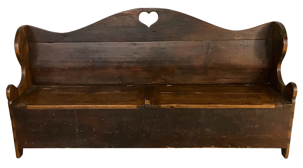 Early Pine Bench with Heart Cut-out and Storage: Early pine bench with cut-out heart shape on back, having storage under seat, 34" H x 72 1/2" L x 16" D.