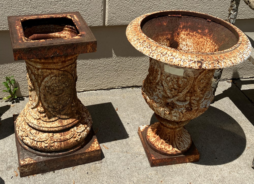 Cast Iron Urn on Pedestal: Cast iron urn on pedestal.