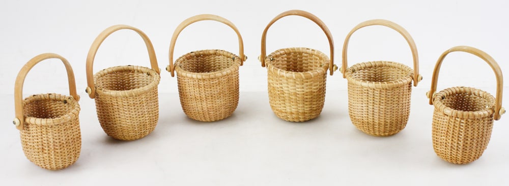 Six Nantucket Swing Handle Baskets: Six Nantucket swing handle baskets, all approximately 4" H x 4" diameter.