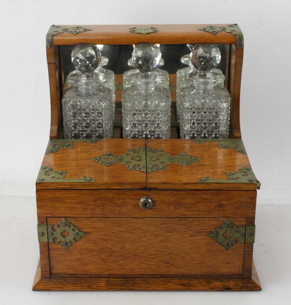 19thC English Tantalus with Cribbage Board: 19th century English tantalus with decanters, Cribbage board, glass tray, secret drawer, marked C.S. London, 14" H x 13" W x 12" D.