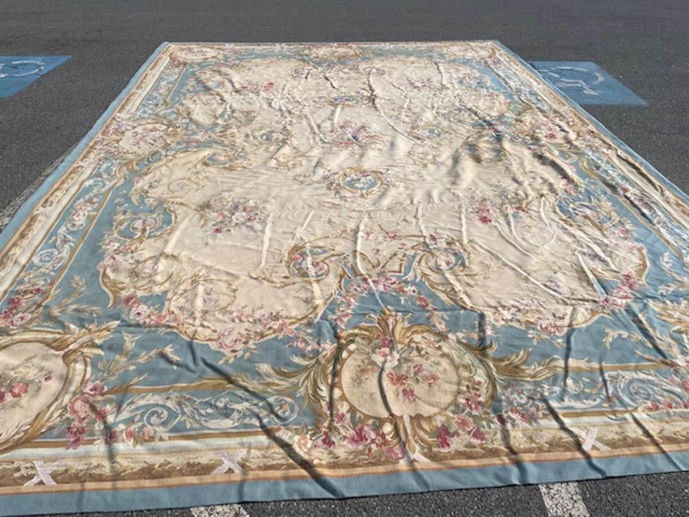 French Aubusson Rug with Powder Blue Field: French Aubusson rug having a powder blue field, 17' 2" x 11' 9".