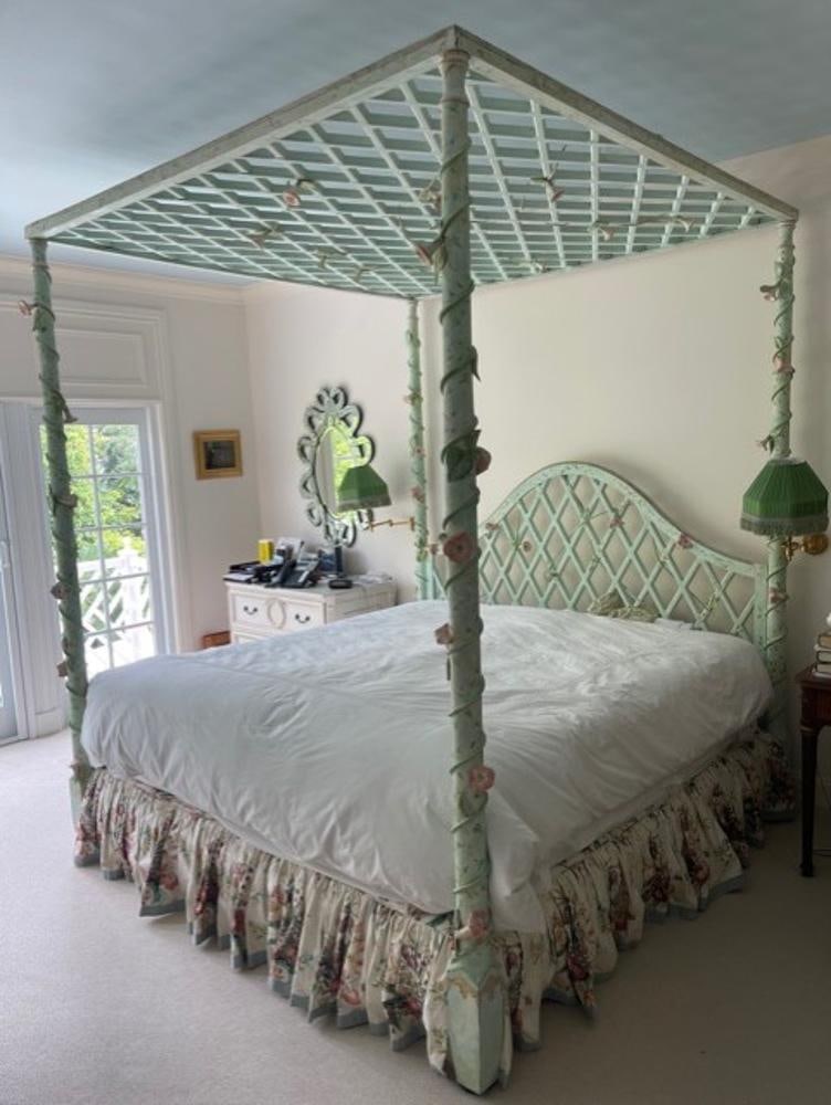 Fancy Designer Hand-Painted Canopy Bed: Fancy designer hand-painted canopy bed having carved posts and lattice work crown, 98" H x 83" L x 83". Includes bedskirt. Leta Foster designed bed.