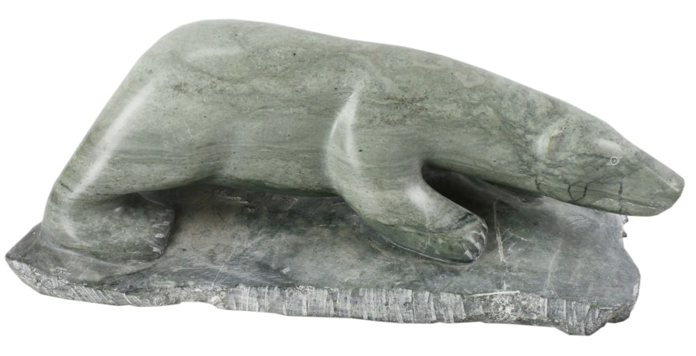 Inuit Soapstone Polar Bear by Pauloosie Tukpanie: Inuit art soapstone prowling polar bear by Pauloosie Tukpanie, 13" L. Provenance: West Newbury, Massachusetts collection.