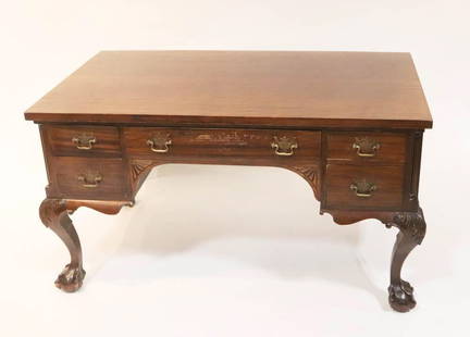 Early 20thC American Chippendale-Style Desk: Early 20th century American Chippendale-style desk, figured mahogany and mahogany veneer, protective glass top over case with five drawers, brass pulls, cabriole legs, ball-and-claw feet, maker unknow