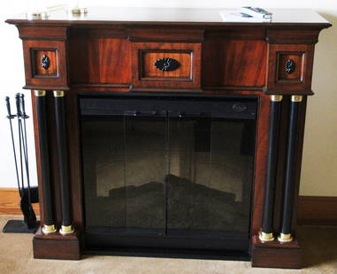 Fine Mahogany Fireplace with Firebox and Tools: Fine mahogany fireplace with Dimplex electric firebox and tools, 46" x 18" x 53". Provenance: Gloucester, Massachusetts estate.