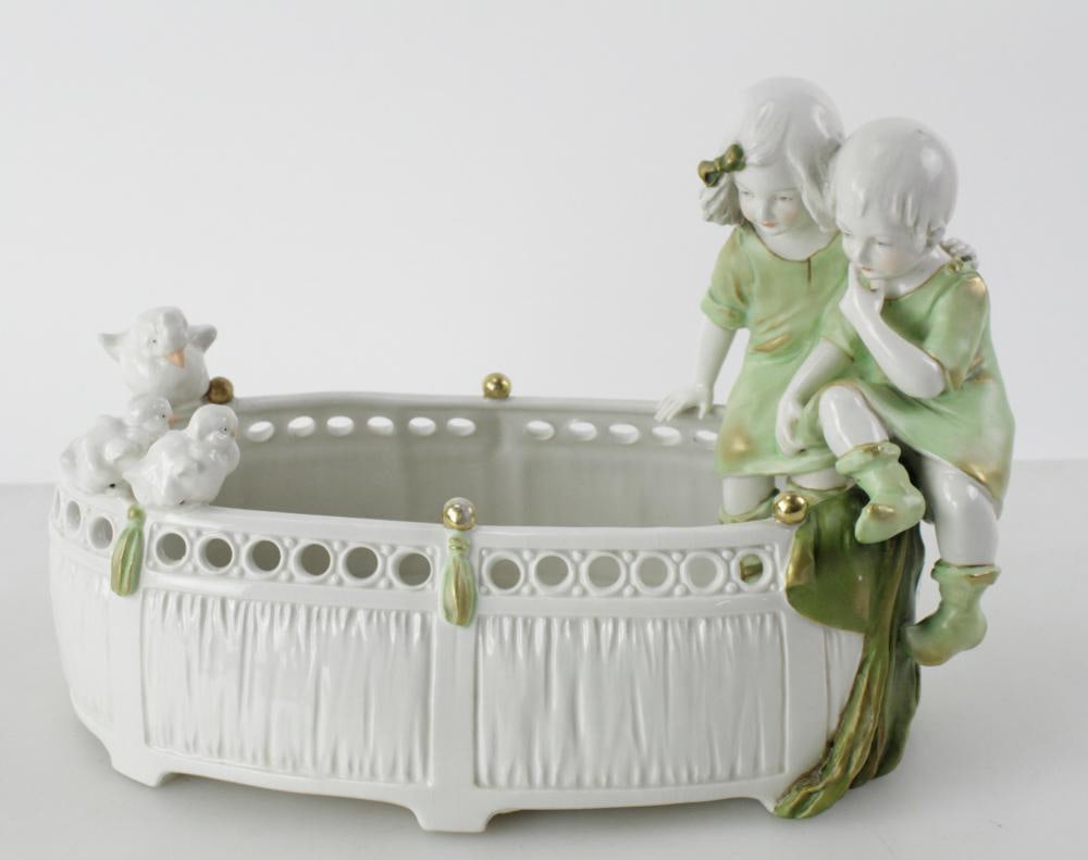 Late 19th/Early 20th Austrian Imperial Amphora Planter: Late 19th/early 20th century charming Austrian Imperial Amphora Art Nouveau porcelain planter with figural children and chicks, 9" H x 13" W x 7 1/4" D. Good condition; possible old small flake repair