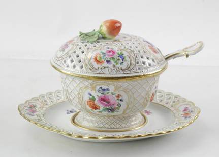 19thC Meissen Porcelain Lidded Serving Dish: 19th century Meissen hand-painted porcelain oval serving dish with reticulated underplate, spoon, and lid with strawberry finial, underplate 11" W. Gold trim has been restored. Old restoration under t
