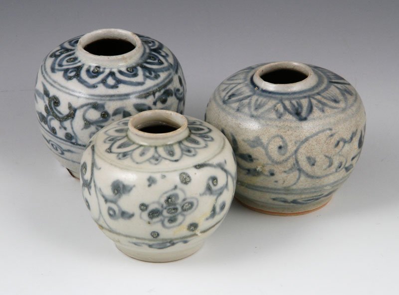 Vietnamese Miniature Jars: Lot of three miniature jars, Vietnam, blue and white glazed, the globular forms decorated with flowers, the shoulders decorated with a band of pointed petals, 2 1/2" h. Provenance: From the Hoi An shi