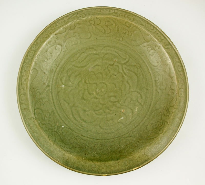 Vietnamese Celadon Charger: Large celadon glazed charger, Vietnam, decorated with an incised flower pattern on the surface of the plate, 17" dia.