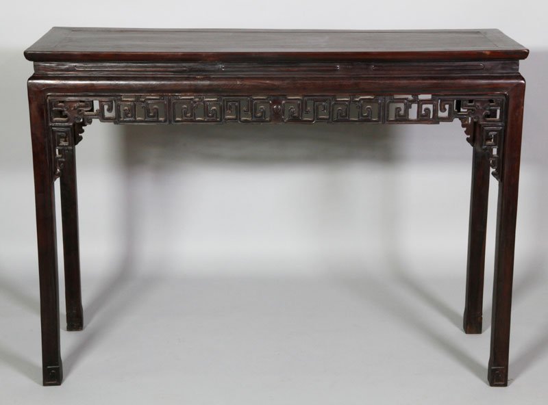 Chinese 18th/19th C. Zitan Altar Table: Zitan altar table, China, 18th/19th century, the rectangular form decorated with intricately carved interlocking scrolls, 47" x 15 1/2" x 34 1/4".