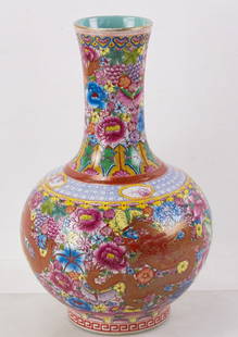 Chinese Dragon and Flower Vase: Chinese dragon and flower vase, having Qianlong mark, 16 1/2" x 10". Provenance: Wells, Maine collection.