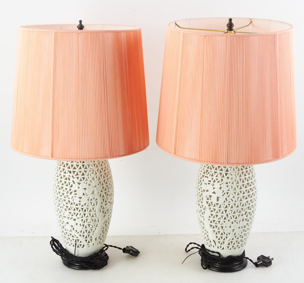 Pair of Chinese Blanc-de-Chine Pierced Porcelain Lamps: Pair of Chinese blanc-de-Chine pierced porcelain lamps with shades, 24" x 6". Provenance: The Susie Hilfiger Collection.