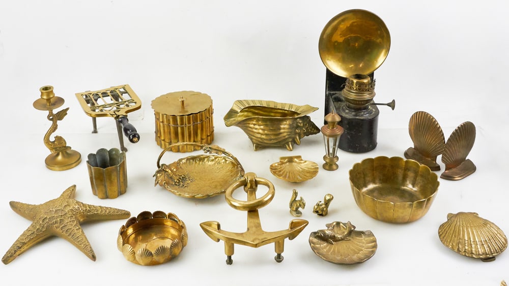 Brass Items, Door Knockers, Trivet, Lamp, Starfish, etc.: Brass items, including anchor door knocker, shell door knocker, trivet, lamp, starfish, etc. Provenance: The Susie Hilfiger Collection.