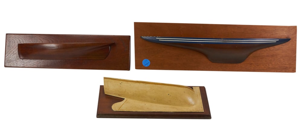 Vintage Half Hull Wall Plaques: Vintage half hull wall plaques, 13" x 2" on board 17" x 4 1/2", 19" x 3" on board 21" x 6", and 11" x 4" on board 12" x 5". Provenance: The Susie Hilfiger Collection.