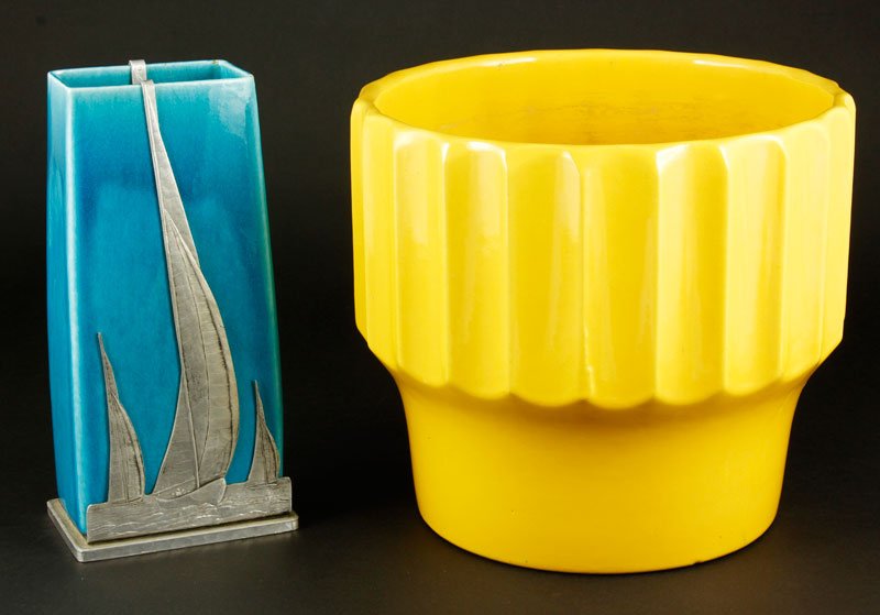 2 Pieces of California Pottery: Two pieces of California pottery to include one Wendell August Forge Aluminum mounted blue stoneware vase with sailboats and one Bauer planter, yellow with fluted sides, each marked on base, vase 9" h
