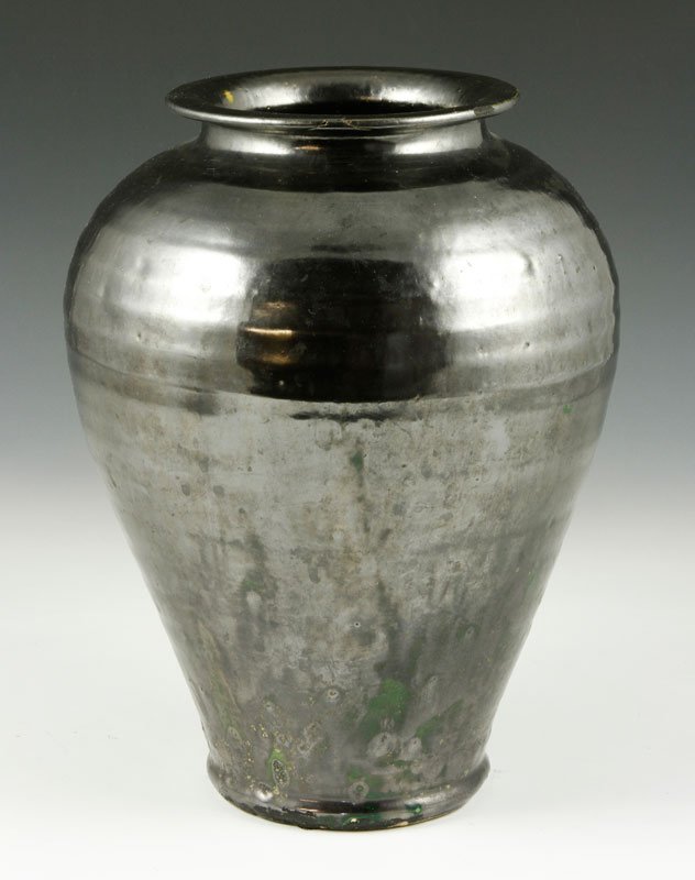 Early North Carolina Oil Jar Form: Early North Carolina oil jar form, gunmetal/mirror black, hand thrown, 10 3/8"h. Some rim damage.