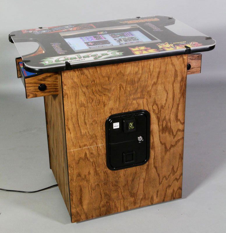 Arcade-Style 2 Person Video Game: Arcade-style cocktail style two person video game having four games: Galaga, Ms. Pac-Man, Frogger, Donkey Kong, coin operated, professional grade, 30 3/4"h x 32"w x 22"d.