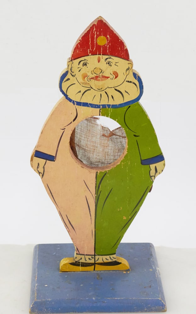 Old Arcade Clown Painted Game: Old arcade clown painted game, 15" x 7" x 7". Provenance: The Susie Hilfiger Collection.