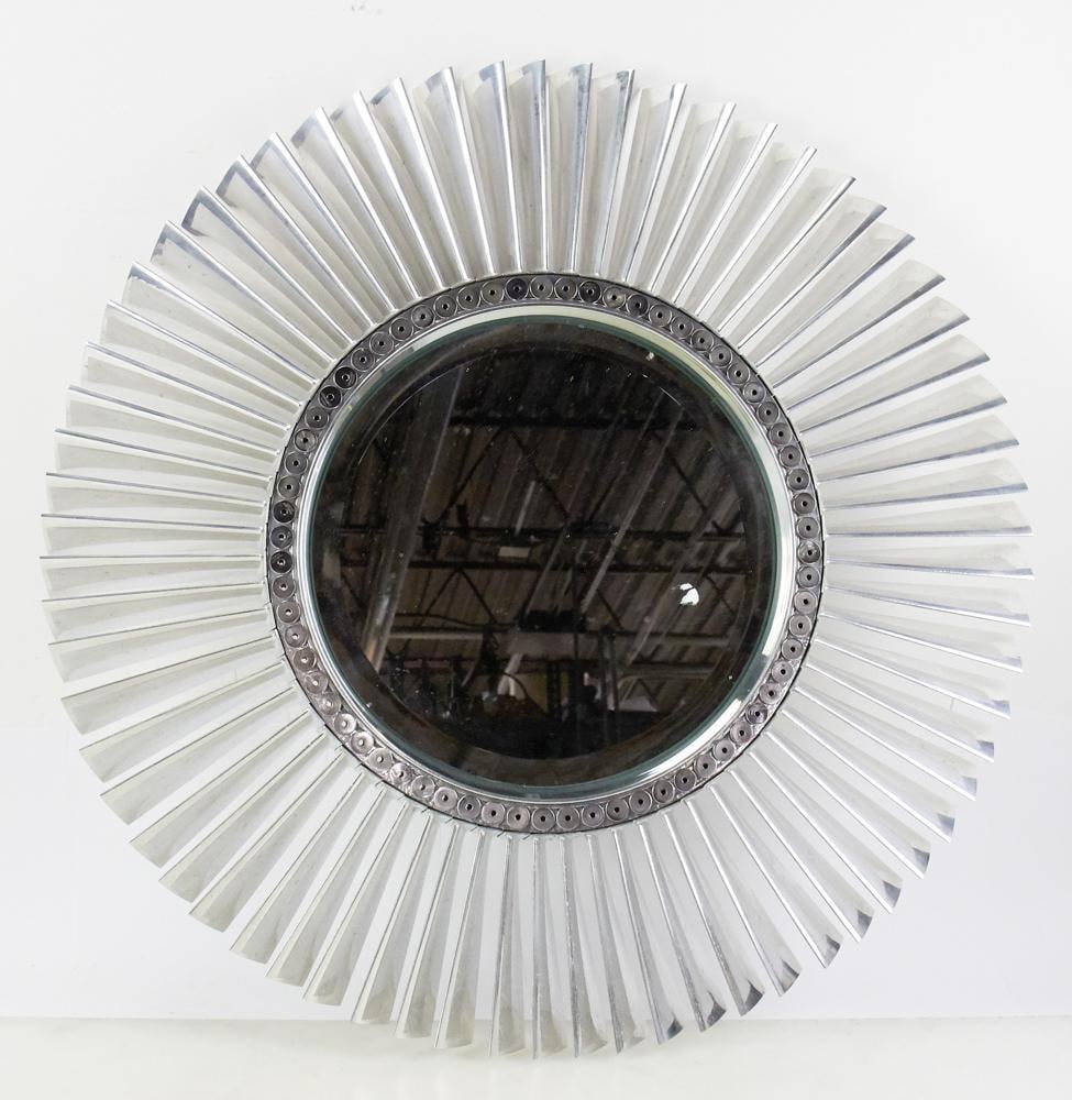 Modern Aluminum Wheel Mirror: Modern aluminum wheel mirror, 27 1/2" diameter, having a beveled glass mirror. Provenance: The Susie Hilfiger Collection.