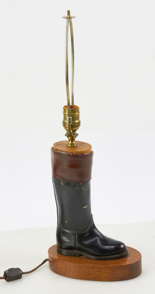 Leather Boot Lamp on Wood Base: Leather boot lamp on wood base, 21" H x 8". Provenance: The Susie Hilfiger Collection.
