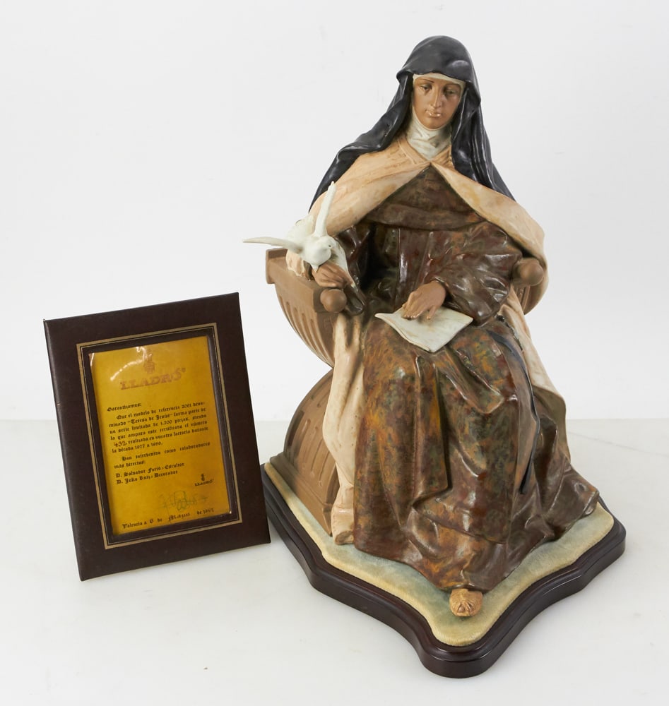 Lladro Figurine of St. Theresa 2061 with Stand: Lladro figurine of St. Theresa ("Teresa de Jesus"), model 2061 (retired), limited edition #432/1200, circa 1980, with stand and certificate, figurine 15 1/2" H x 10 1/2" W x approximately 13" D. Prove