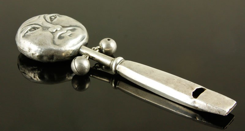 Rare Shiebler Baby Rattle: Rare Shiebler baby rattle/whistle, sterling silver, "Man in the Moon," design, art nouveau, man in the moon face on one side, and a flying bat on the reverse, 4 7/8" l, approximately 1.1 troy ounces T